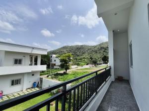 a view from the balcony of a house at Rayta Aravalli View Villa in Udaipur