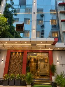 a store in front of a tall building at Hotel Bell Montana Stay Near IGI Airport Delhi- Free Airport Pickup & Drop in New Delhi