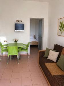 a living room with a couch and a table at Beachside Apartments Smajlaj in Velipojë
