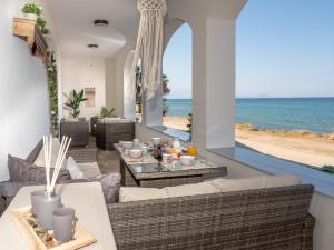 a living room with a view of the ocean at Sea Memories Villa in Skaleta