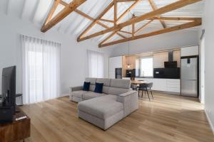 a living room with a couch and a table at Casa da eira in Ribeira Grande