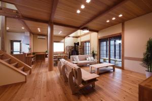 a living room with a couch and a table at 刀都の郷 清川 in Sekimachi