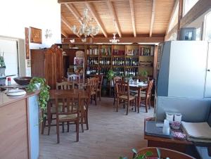 a restaurant with a dining room with a table and chairs at B & B Dei Nobili in Bitetto