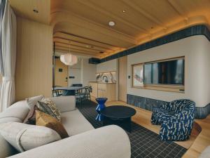 a living room with a couch and a tv at illi Sen Oshiage in Tokyo +41 photos