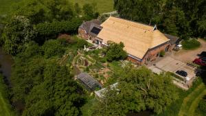 an overhead view of a house with a garden at Tiny House Lau at Glamping Verbaarum in Bedum +30 photos