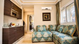 a living room with a couch and a chair at Palais Riad Reda & Spa in Fez