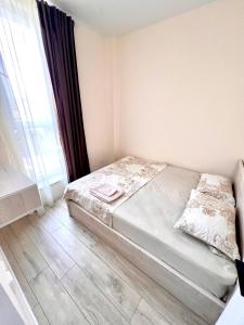 a bedroom with a bed and a large window at Hayrapetyan Guest House in Yeghegnadzor