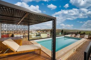 a pool on the roof of a house at Dar Lys Luxury Riad & Spa in Fez