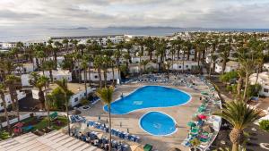 an aerial view of a resort with a swimming pool at Ona Las Brisas in Playa Blanca