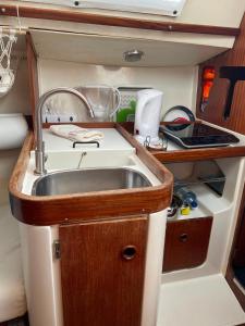 a kitchen with a sink in an rv at The Happy Sailor in Viana do Castelo