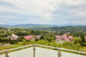 a view of a town from the balcony of a house at Apartamenty w Żywcu u Astrid in Żywiec