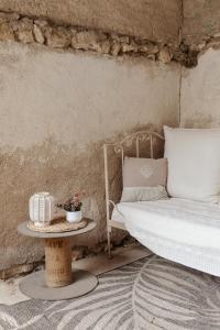 a bedroom with a bed and a table at La Marmittiere in Civray-de-Touraine