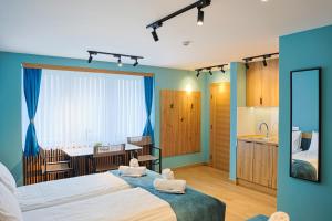 a bedroom with a large bed and a bathroom at FourMountains-Bjelašnica in Sarajevo