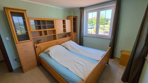 a bedroom with a bed and a dresser and window at New Big Butterfly Rooms - Free parking in Koper +18 photos