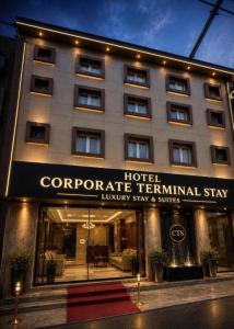 a hotel with a sign on the front of it at Corporate Terminal Stay By Velocity Hotels Delhi IGI Airport Terminal 3 With Free Airport Pickup in New Delhi