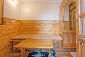 a wooden sauna with a bench in it at Lilly's Valley Resort in Kodaikānāl