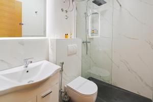 a bathroom with a toilet and a sink and a shower at FourMountains-Igman in Sarajevo +8 photos