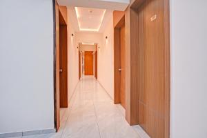 a corridor of an office building with a hallway at FabHotel Royal Midway in Gandhinagar