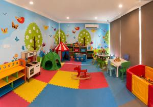 a childs room with a play area with a play set at Fraser Suites Muscat in Muscat