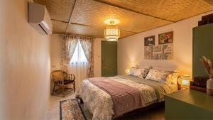 a bedroom with a bed and a flat screen tv at Le Panpurie Koh Lanta Resort - Near the Beach in Ko Lanta