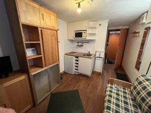 a small apartment with a kitchen and a living room at Cool ski Tignes chalet relax in Tignes