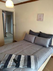 a large bed in a room with at Halkett Corner in Kimberley
