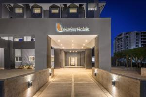 a building with a sign on the side of it at Hathor Hotels Mendoza in Mendoza