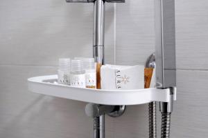 a sink in a bathroom with towels on it at Home Joséphine - Caserta in Caserta +68 photos