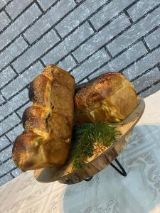 two loaves of bread on a plate on a table at CASA R&D in Moisei