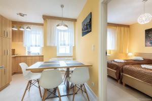 Posteľ alebo postele v izbe v ubytovaní Apartament Posejdon Kołobrzeg