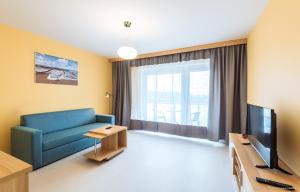 Televízia a/alebo spoločenská miestnosť v ubytovaní Apartament Posejdon Kołobrzeg