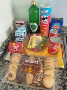 a table with a bunch of food on a counter at Confortable piso en Ares in Ares +3 photos