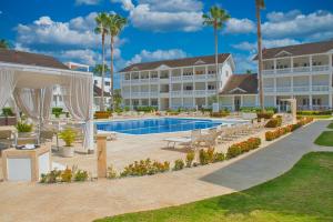 a hotel with a swimming pool and a resort at Villa Chiara Beachfront Las Terrenas in El Limón
