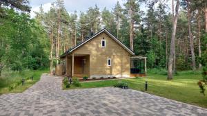 a small house in the middle of a forest at Kloogaranna Seaside Cottage in Kloogaranna