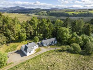 an aerial view of a house in the countryside at Upper Hillside Cottage in Blairgowrie
