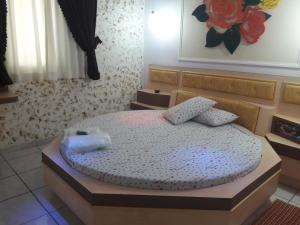 Una cama o camas en una habitación de Motel Sedução