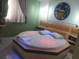 Una cama o camas en una habitación de Motel Sedução