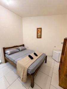 a bedroom with a bed in a room at Pousada Gire in Itacaré