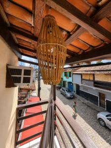 a chandelier hanging from the ceiling of a building at Pousada Gire in Itacaré +49 photos