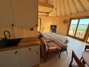 a kitchen with a sink and a bed in a room at Forest Marina  +52 photos