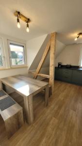 a room with a wooden table in a room at Sonnenstüble in Eriskirch