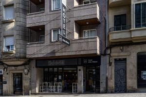 a store front of a building on a city street at Alda Altiana in Ourense