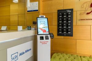 a cell phone on a reception counter in a store at Alda Altiana in Ourense