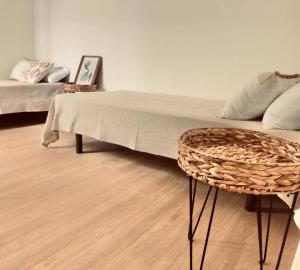 a living room with a couch and a table and a chair at Paraísos de Agaete in Puerto de las Nieves
