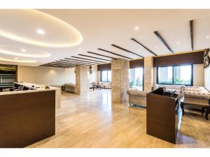 a living room with couches and a lobby at Hotel Park Premium With Restaurant & Banquet Ujjain - By D S Stay Group in Ujjain