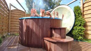 a group of people in a hot tub with a mirror at Schullandheim Sohland Spree in Auf der Wiese