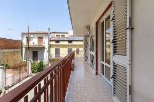 a balcony of a building with a walkway at Appartamento Rina Centro Sicilia in Pietraperzia