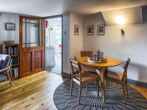 a dining room with a table and chairs at Lee Cottage - E4343A in Holy Island