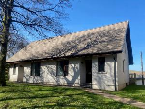 a white house with a gambrel roof at Puffin - Dubh Segir in Lerags +5 photos