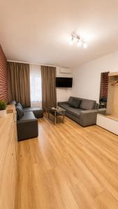 a living room with a couch and a table at Apartament Bielsko in Bielsko-Biała